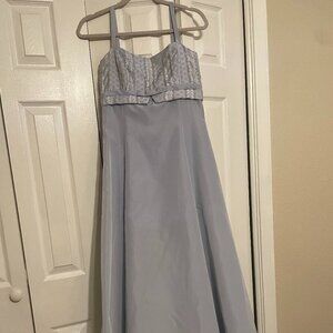 A soft light‑blue (almost lavender‑toned) dress with a fitted lace bodice
